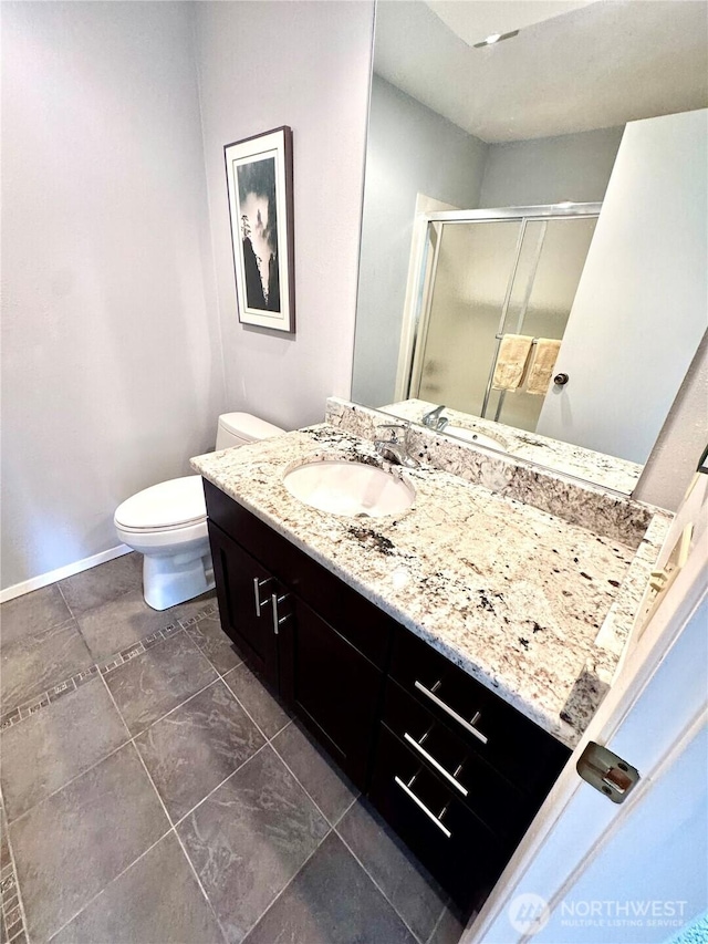 332 162nd Pl SE, Bothell, WA 98012 - bathroom featuring a stall shower, vanity, toilet, and baseboards