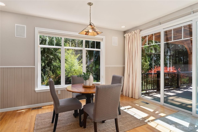 702 Woodland Dr, Port Townsend, WA 98368 - dining room with light wood-style floors, plenty of natural light, a wainscoted wall, and recessed lighting