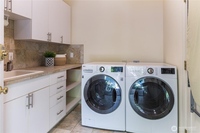 702 Woodland Dr, Port Townsend, WA 98368 - washroom with washer and clothes dryer and cabinet space