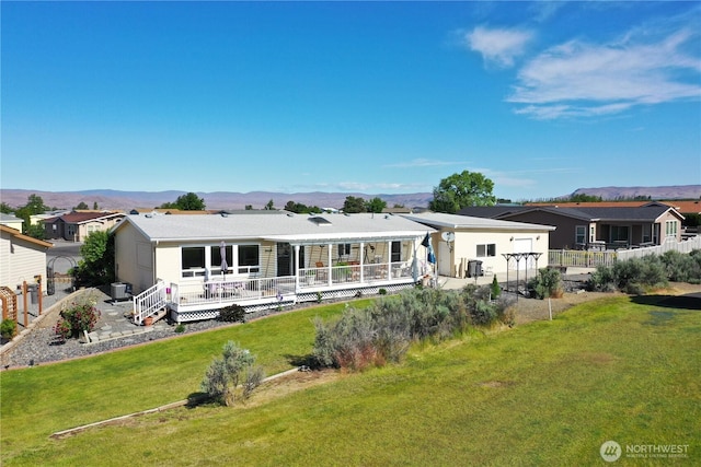 327 Buttercup Ln SW, Mattawa, WA 99349 - rear view of house featuring a deck with mountain view