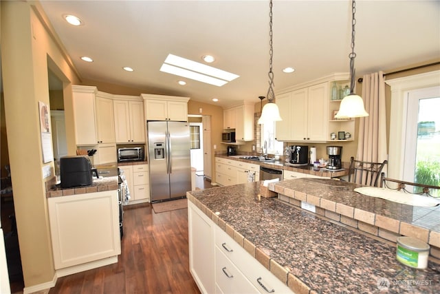 327 Buttercup Ln SW, Mattawa, WA 99349 - kitchen with appliances with stainless steel finishes, a sink, open shelves, a skylight, and dark wood finished floors