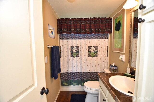 327 Buttercup Ln SW, Mattawa, WA 99349 - full bathroom with vanity, toilet, curtained shower, and wood finished floors