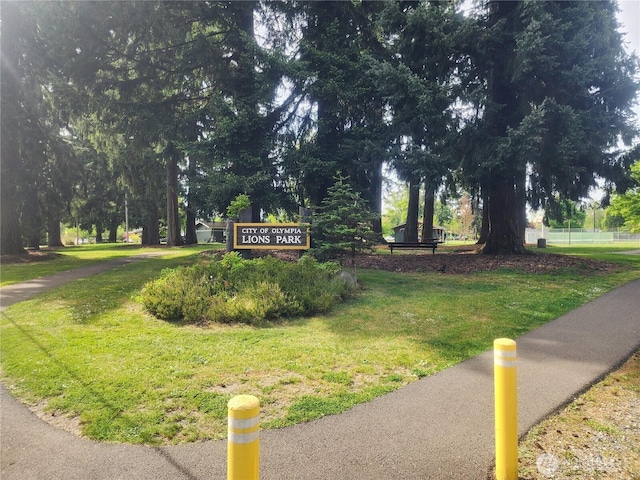 view of property's community with a lawn