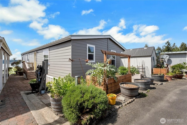 4805 Cushman Rd NE Unit 61, Olympia, WA 98506 - view of side of home with a vegetable garden
