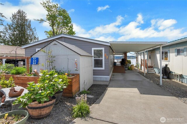 4805 Cushman Rd NE Unit 61, Olympia, WA 98506 - view of front of property featuring a vegetable garden and concrete driveway