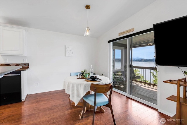 4805 Cushman Rd NE Unit 61, Olympia, WA 98506 - dining area with wood finished floors, vaulted ceiling, and baseboards