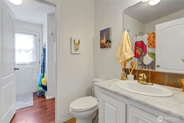 4805 Cushman Rd NE Unit 61, Olympia, WA 98506 - full bath with wood finished floors, toilet, vanity, and baseboards