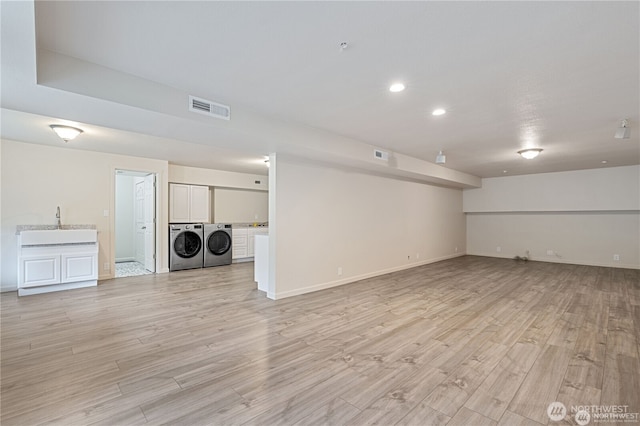 30521 NE 147th Ct, Battle Ground, WA 98604 - basement with washer and clothes dryer, light wood-style floors, baseboards, and recessed lighting