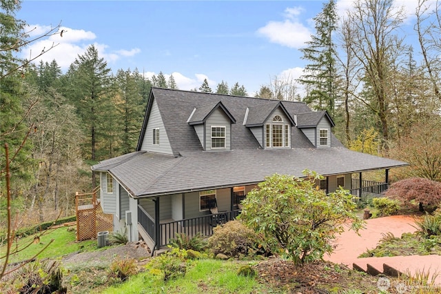 30521 NE 147th Ct, Battle Ground, WA 98604 - view of front of home with covered porch, a shingled roof, and central AC