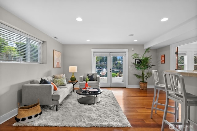 257 3rd Ave, Fox Island, WA 98333 - living area with recessed lighting, wood finished floors, and baseboards