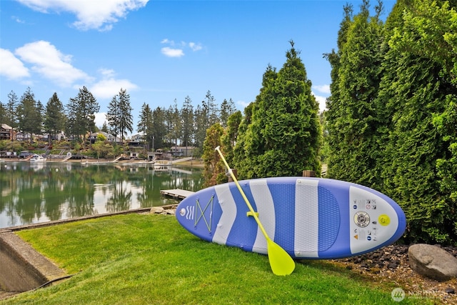 257 3rd Ave, Fox Island, WA 98333 - view of community with a lawn, a water view, and a dock