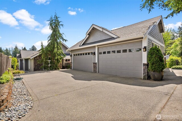 257 3rd Ave, Fox Island, WA 98333 - single story home featuring stone siding, driveway, a garage, and a shingled roof