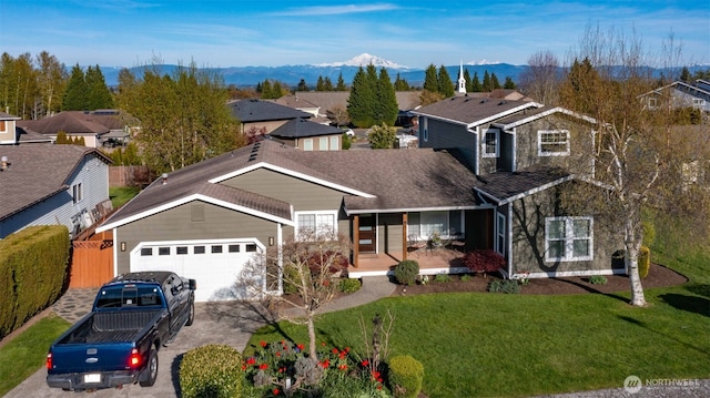 6130 Pacific Heights Dr, Ferndale, WA 98248 - traditional-style house featuring covered porch, concrete driveway, a garage, a residential view, and a mountain view