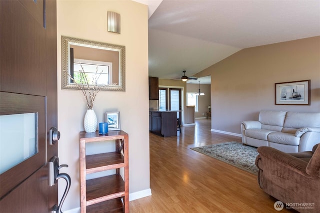 6130 Pacific Heights Dr, Ferndale, WA 98248 - foyer entrance with light wood-type flooring, lofted ceiling, baseboards, and a ceiling fan