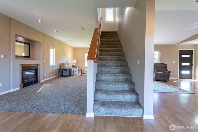 6130 Pacific Heights Dr, Ferndale, WA 98248 - stairs with baseboards, plenty of natural light, wood finished floors, and recessed lighting