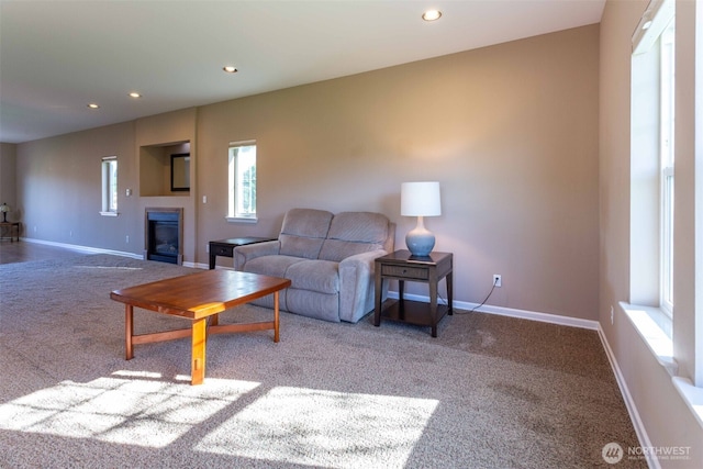 6130 Pacific Heights Dr, Ferndale, WA 98248 - living room with carpet flooring, recessed lighting, a glass covered fireplace, and baseboards