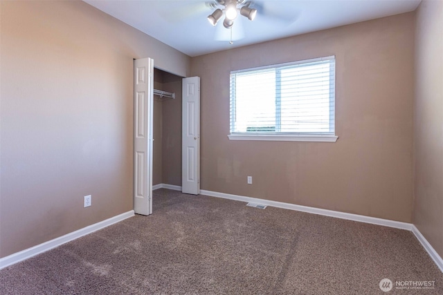 6130 Pacific Heights Dr, Ferndale, WA 98248 - unfurnished bedroom with carpet, baseboards, a closet, and a ceiling fan