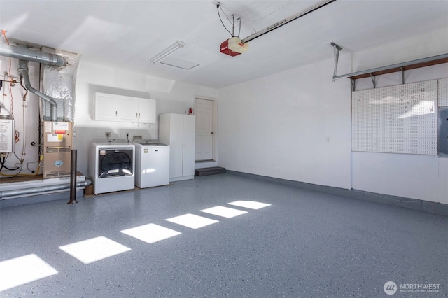 6130 Pacific Heights Dr, Ferndale, WA 98248 - garage with washer and dryer, a garage door opener, baseboards, and electric panel