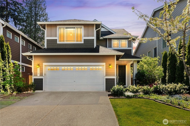 view of front facade with driveway, an attached garage, a front lawn, and roof with shingles