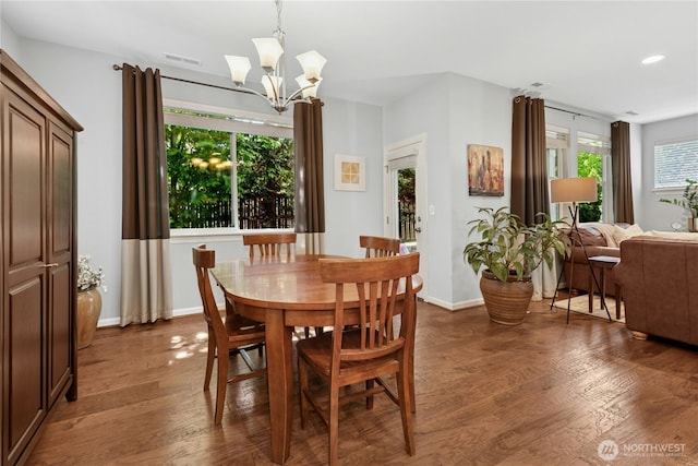 dining room featuring wood finished floors, a chandelier, baseboards, and recessed lighting