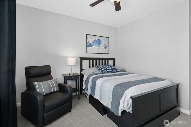 carpeted bedroom featuring a ceiling fan and baseboards