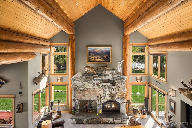 carpeted living room with rustic walls, wood ceiling, high vaulted ceiling, and a stone fireplace