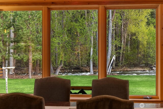 entryway featuring a view of trees