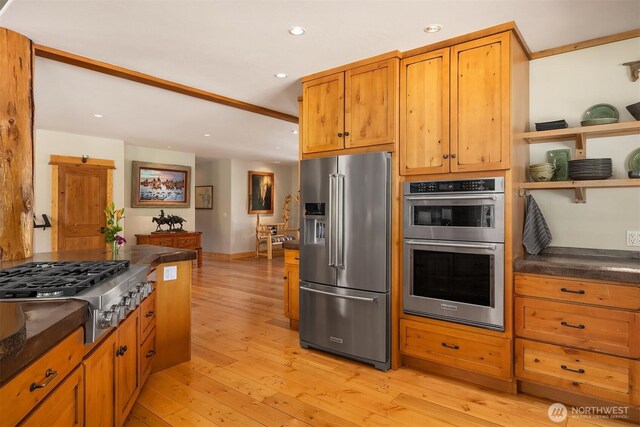 kitchen with stainless steel appliances, dark countertops, light wood-style flooring, recessed lighting, and open shelves