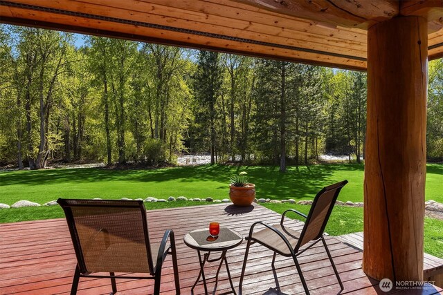 wooden deck with a yard