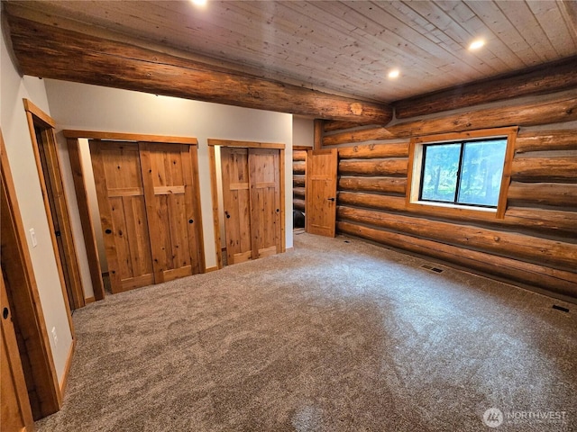 31314 555th Street Ct E, Ashford, WA 98304 - unfurnished bedroom with recessed lighting, wooden ceiling, carpet, rustic walls, and multiple closets