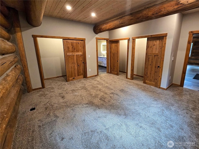 31314 555th Street Ct E, Ashford, WA 98304 - unfurnished bedroom featuring multiple closets, recessed lighting, carpet flooring, baseboards, and wood ceiling