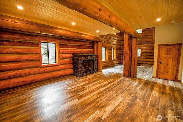 31314 555th Street Ct E, Ashford, WA 98304 - unfurnished living room featuring log walls, wood-type flooring, healthy amount of natural light, a fireplace, and wood ceiling