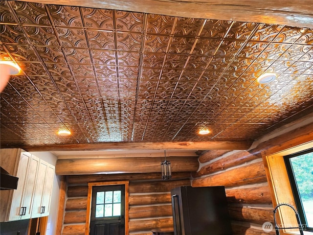 31314 555th Street Ct E, Ashford, WA 98304 - detailed view of fridge, rustic walls, an ornate ceiling, and white cabinets