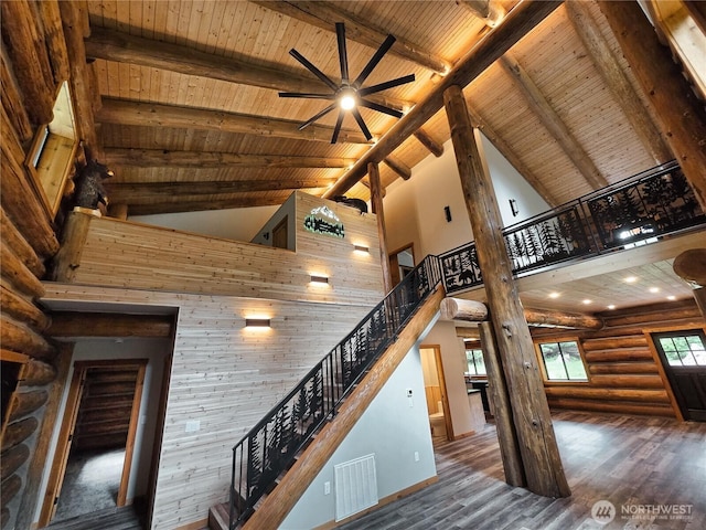 31314 555th Street Ct E, Ashford, WA 98304 - staircase featuring high vaulted ceiling, wood ceiling with exposed beams, a ceiling fan, wood finished floors, and baseboards