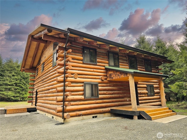 31314 555th Street Ct E, Ashford, WA 98304 - view of side of home with log exterior and crawl space