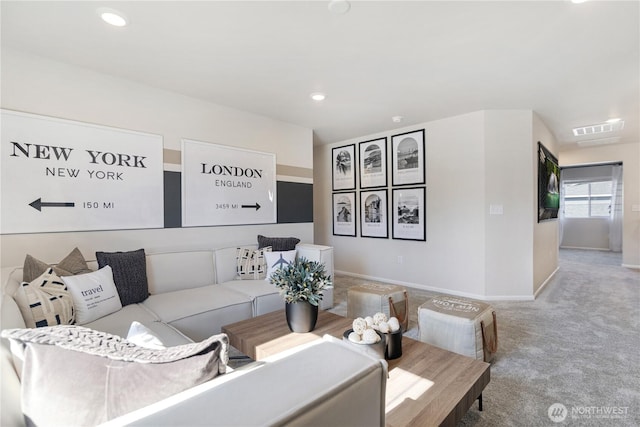 carpeted living room featuring baseboards and recessed lighting