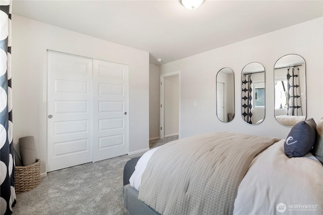 bedroom featuring carpet flooring, a closet, and baseboards