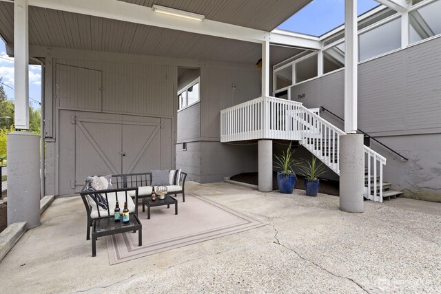 view of patio / terrace featuring outdoor lounge area and stairs