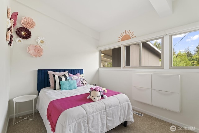 bedroom featuring carpet floors and baseboards