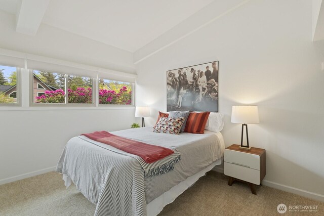 carpeted bedroom featuring baseboards