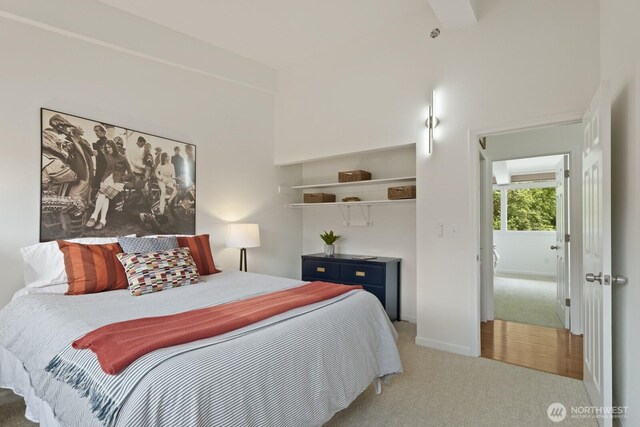 bedroom featuring carpet flooring, baseboards, and a closet