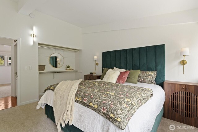 bedroom with carpet and baseboards