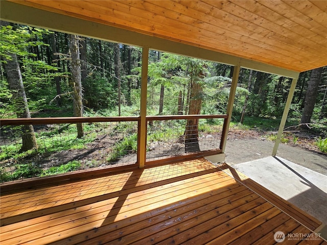 244 Skate Creek Rd N, Ashford, WA 98328 - wooden deck with a patio area and a wooded view