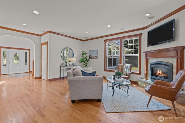 13514 95th Ave NE, Arlington, WA 98223 - living area with light wood-style flooring, a fireplace, ornamental molding, recessed lighting, and baseboards
