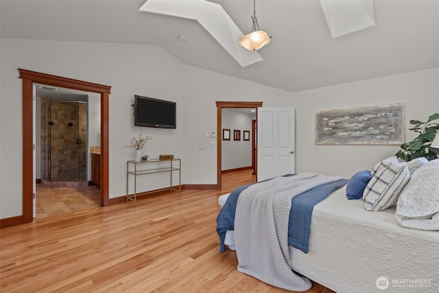 13514 95th Ave NE, Arlington, WA 98223 - bedroom with a skylight, lofted ceiling, light wood-type flooring, and baseboards