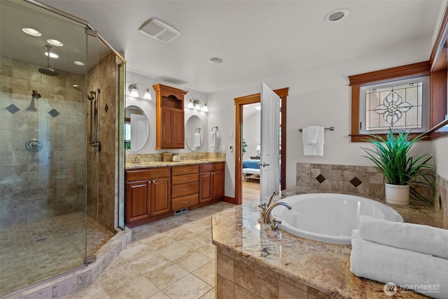 13514 95th Ave NE, Arlington, WA 98223 - bathroom featuring a shower stall, a bath, double vanity, recessed lighting, and tile patterned floors