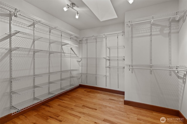 13514 95th Ave NE, Arlington, WA 98223 - spacious closet featuring light wood-style flooring and a skylight