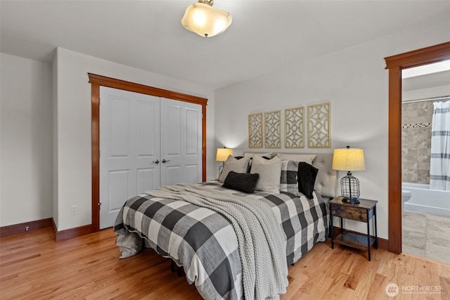 13514 95th Ave NE, Arlington, WA 98223 - bedroom featuring light wood-style floors, a closet, and baseboards