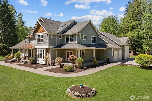 13514 95th Ave NE, Arlington, WA 98223 - rear view of house with a porch, a lawn, and stone siding