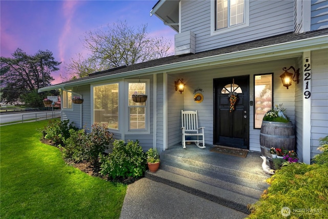 2219 W Pioneer Ave, Puyallup, WA 98371 - doorway to property with covered porch and a shingled roof